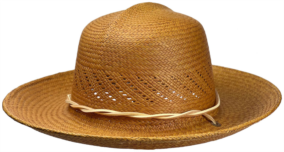 Caramel straw hat with a wide brim on a white background