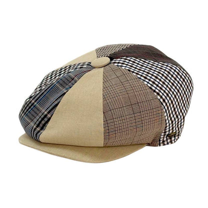 A patchwork flat cap hat featuring beige canvas panels, brown and black gingham plaid, and blue plaid sections, with a small button on top, shown on a white background.