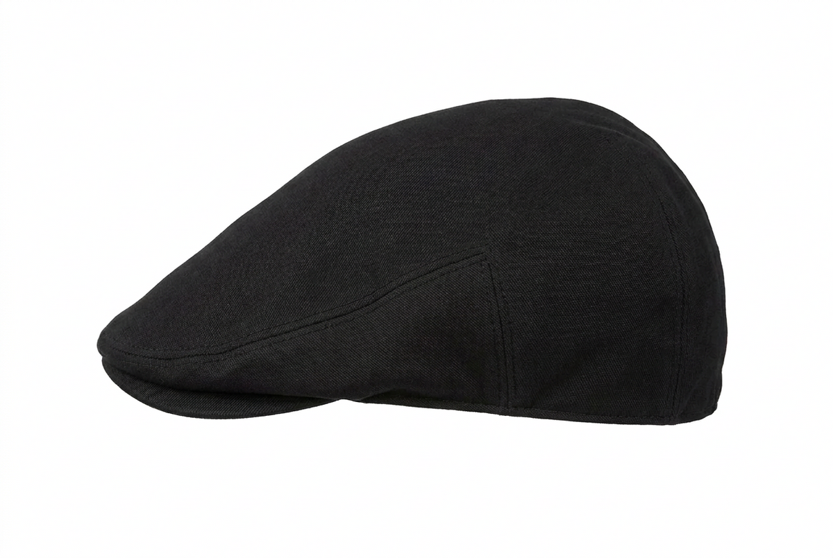 A black flat cap with a structured crown and curved brim, shown in profile against a solid white background.
