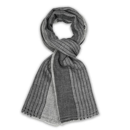 A gray knit scarf with vertical dotted stripes and a lighter gray solid panel, styled in a loop on a white background.