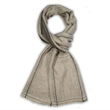 A khaki knit scarf with black dotted stripe accents, styled in a loop on a white background.