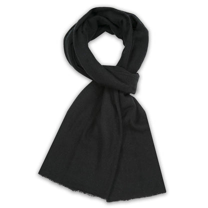 A solid black scarf, knotted and draped to show its soft texture and lightweight edges, set against a plain white background.