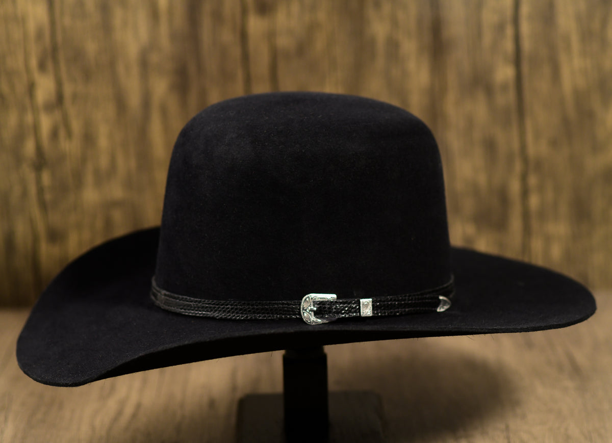A dark navy blue beaver fur cowboy hat with a 5-inch open crown and a leather sweatband.